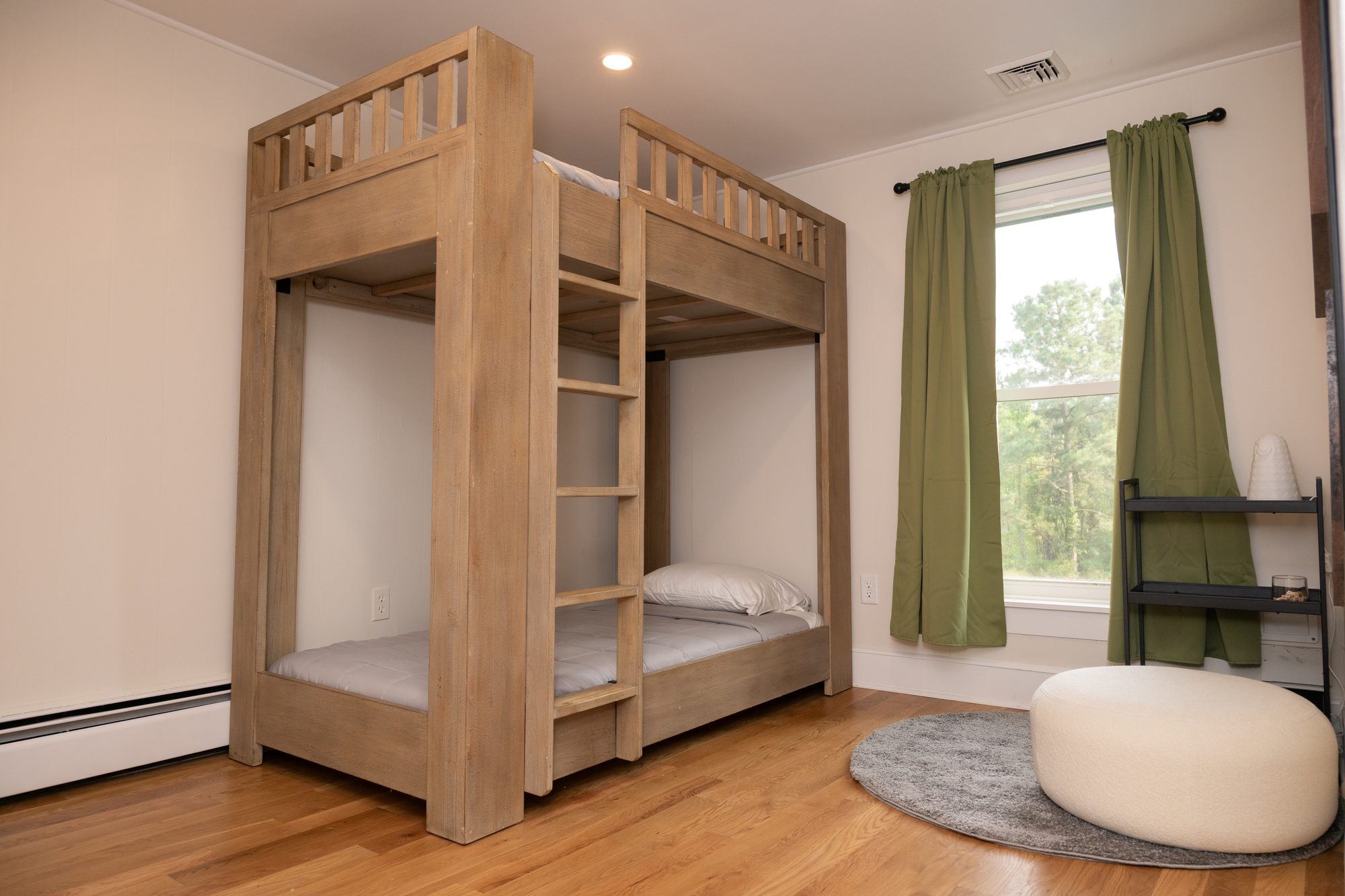 Bunk room with custom wood bunk beds