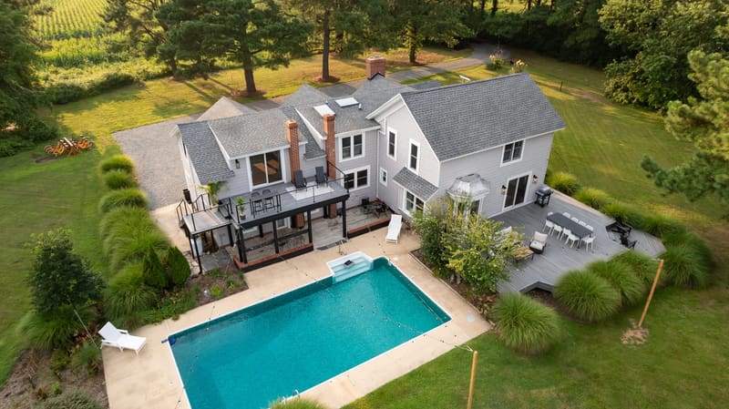 Aerial view of the pool, deck and lawn