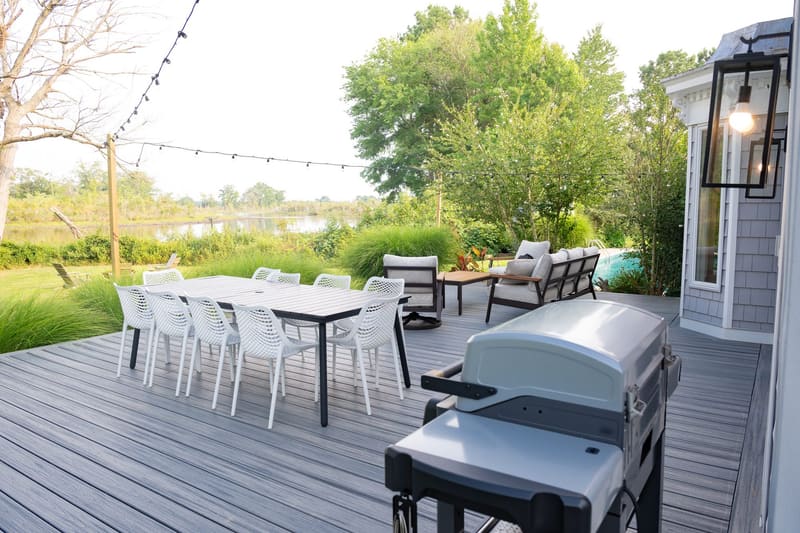 The grill and outdoor dining area on the deck
