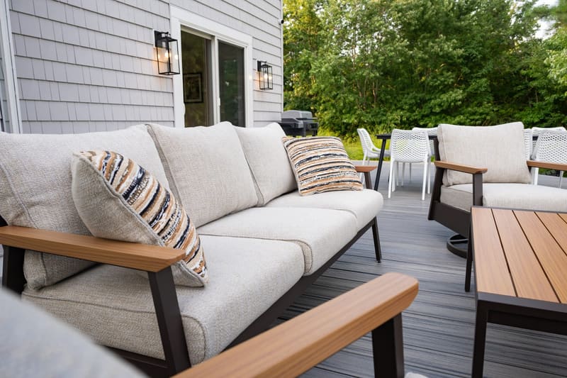 Deck lounge seating with cushions and a coffee table