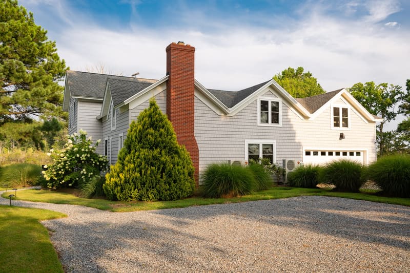 The front of the farmhouse and the gravel drive