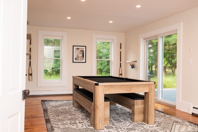 Pool table and seating in the sunroom