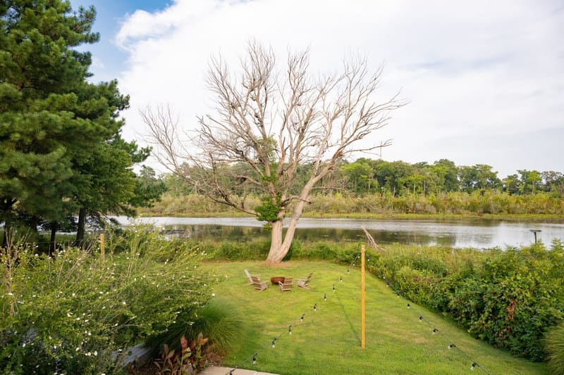 Five acres of open lawn running down to the river