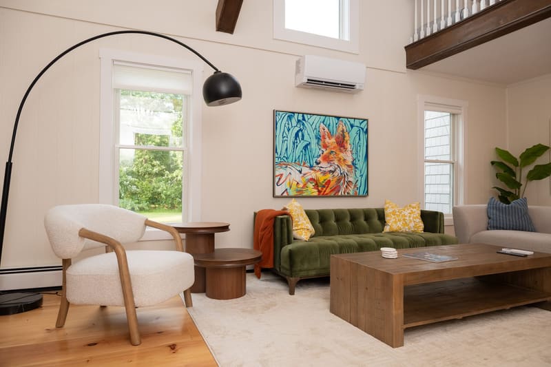 Another view of the living room and its wide-plank pine floors