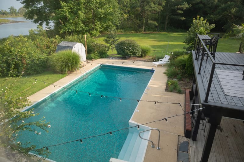 Loungers along the length of the pool