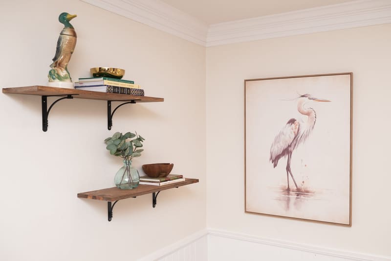 Walnut shelf with a decoy and heron print